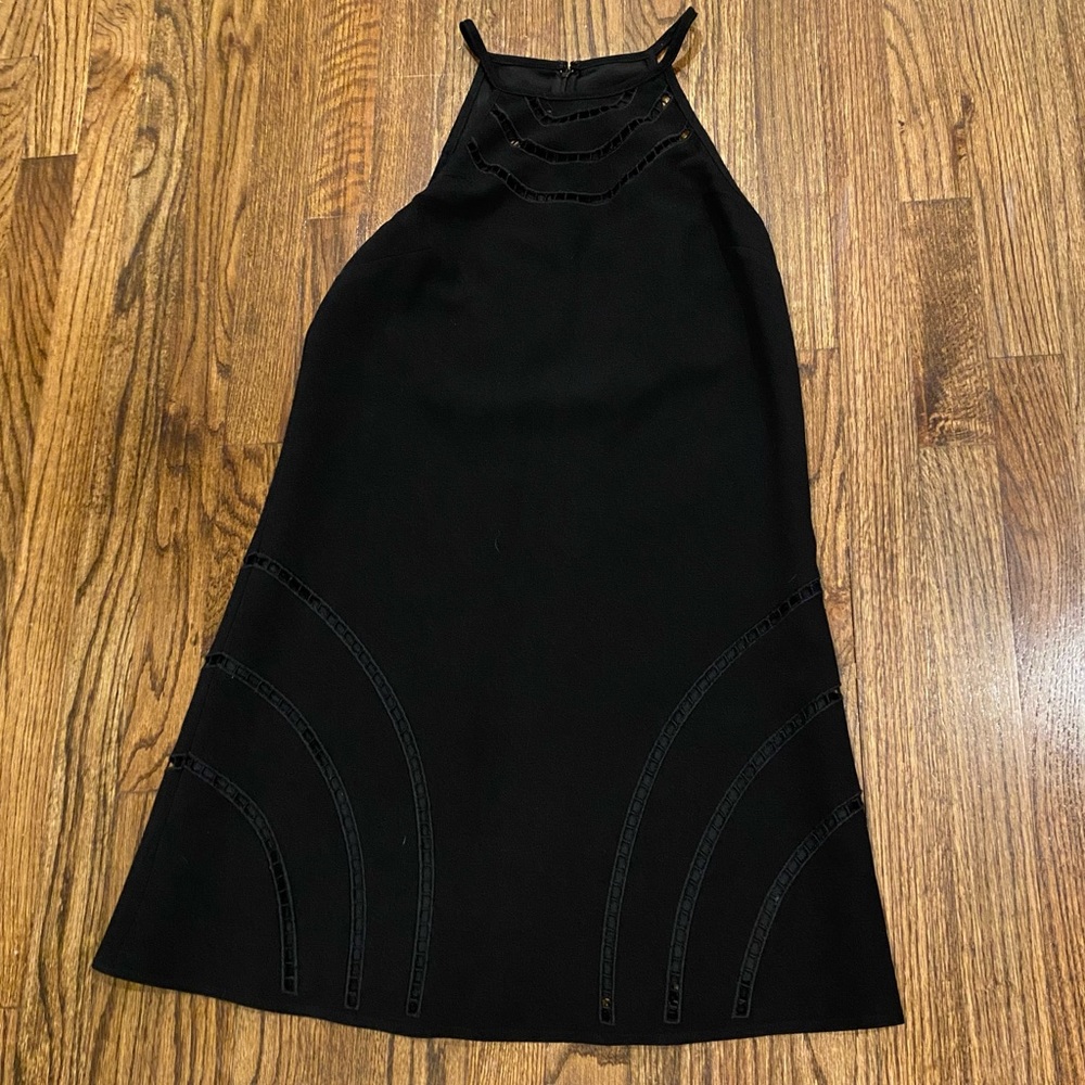 Trina Turk elegant black dress. Knee length. Sleeveless. Cutout detail. Sz 4